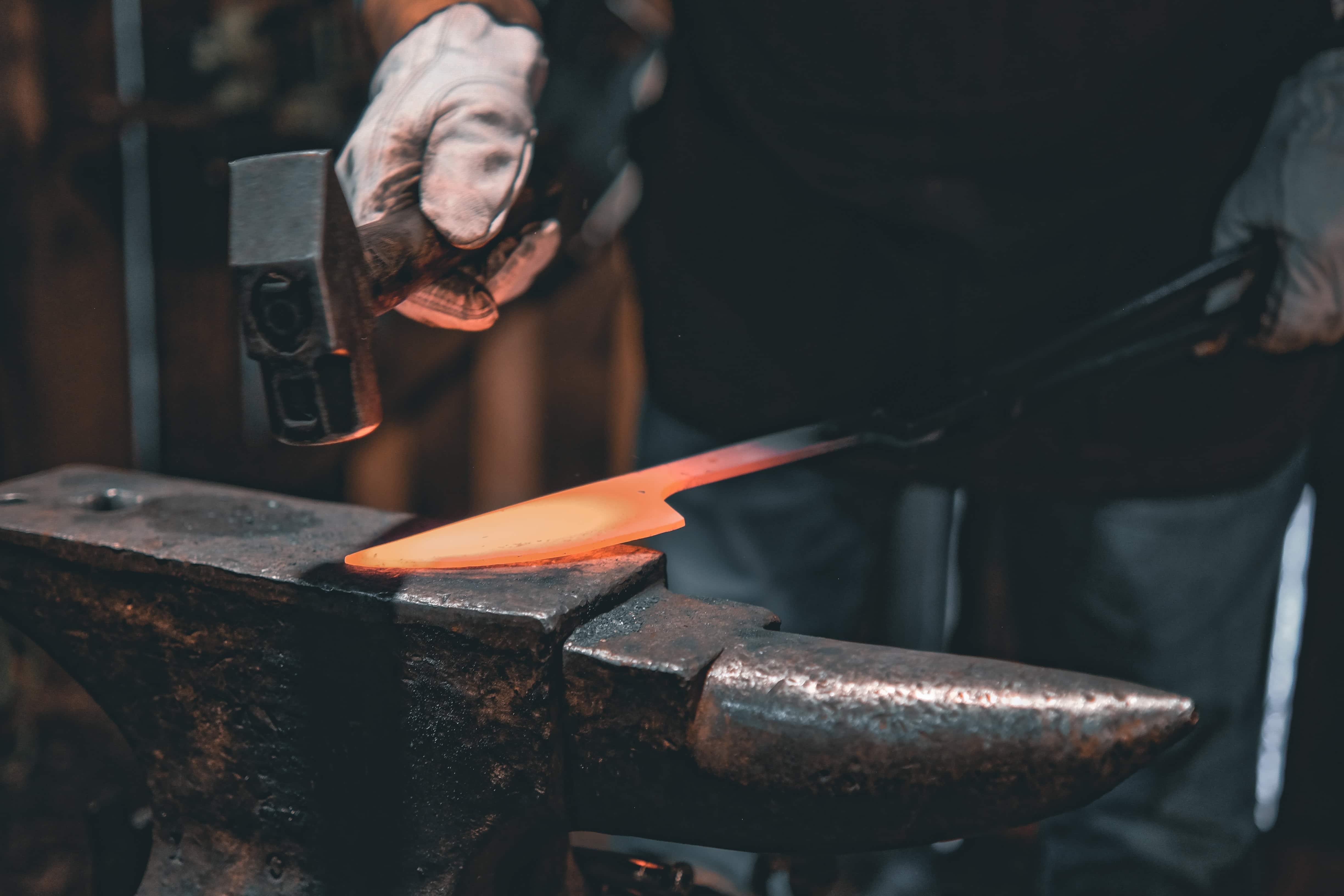 Glowing blade on anvil