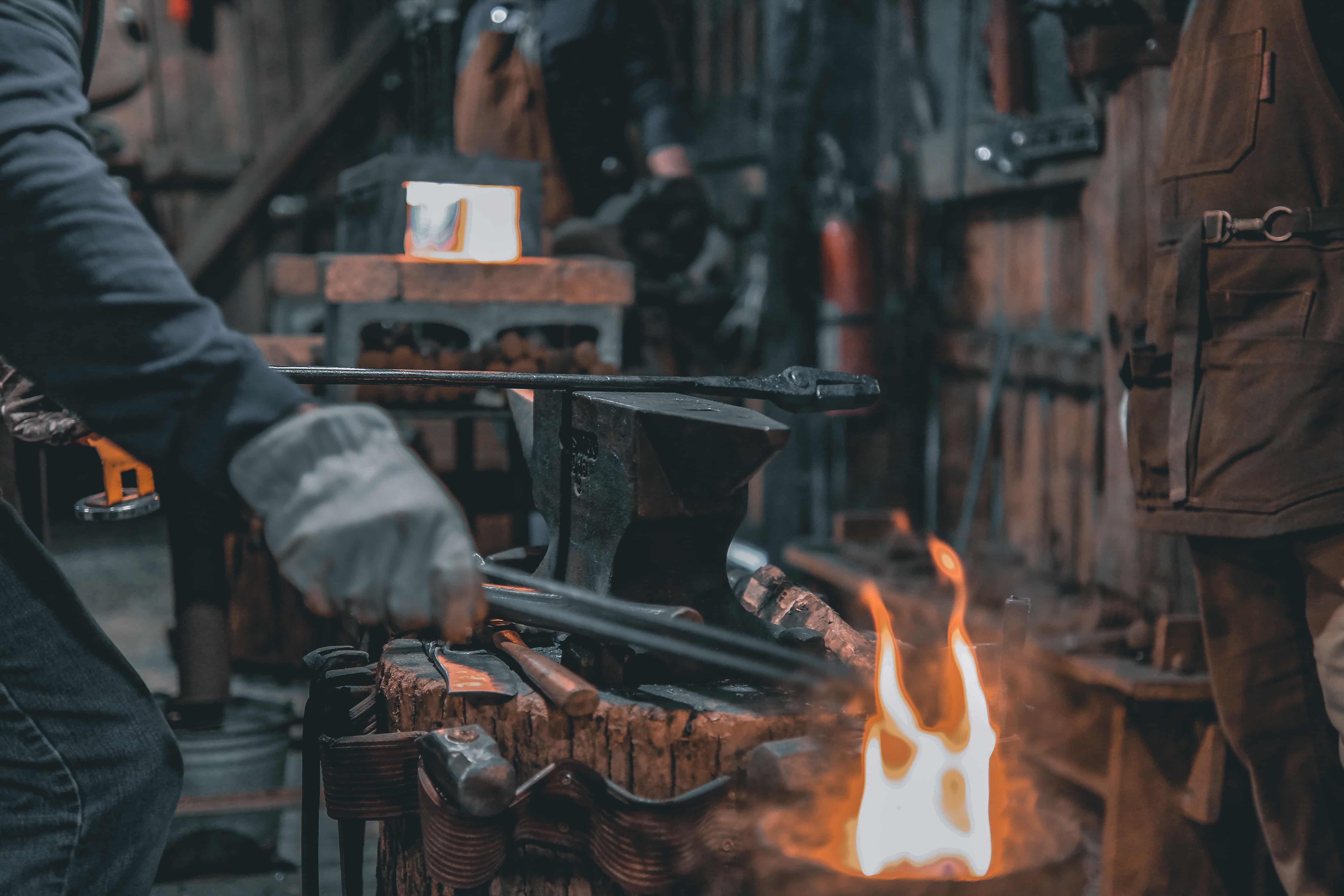 Smith with tongs and steam